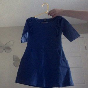 long blue dress with ruffles beside the sleeve